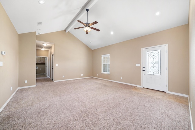 unfurnished living room with lofted ceiling with beams, baseboards, and light colored carpet