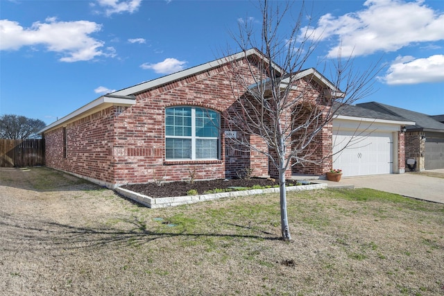 view of front of property featuring brick siding, concrete driveway, an attached garage, fence, and a front lawn