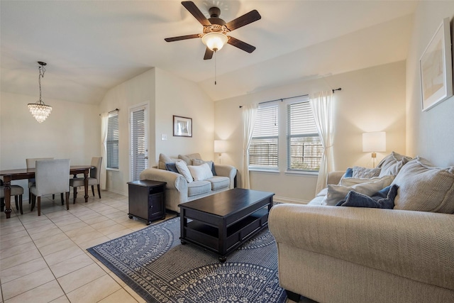 2278 Bryant Ln, Fate, TX 75189 - living room featuring vaulted ceiling, a ceiling fan, light tile patterned floors, a chandelier, and baseboards