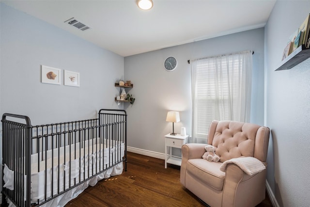 2278 Bryant Ln, Fate, TX 75189 - bedroom with wood finished floors, baseboards, and a nursery area