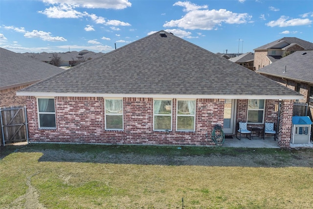 2278 Bryant Ln, Fate, TX 75189 - back of house with roof with shingles, brick siding, and a patio area