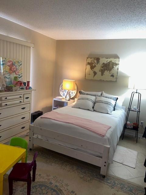 bedroom featuring a textured ceiling