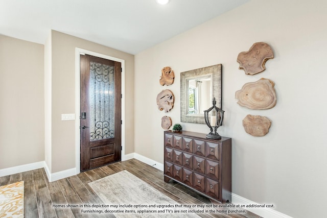 foyer entrance with wood tiled floor and baseboards