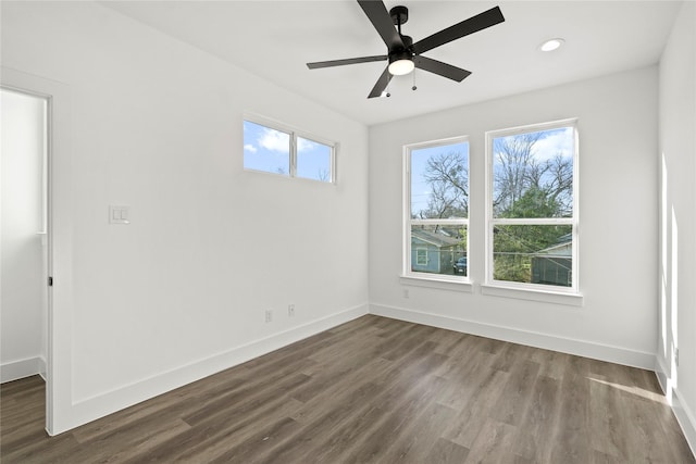 empty room featuring ceiling fan, recessed lighting, dark wood finished floors, and baseboards