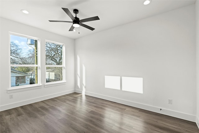 unfurnished room featuring ceiling fan, recessed lighting, dark wood finished floors, and baseboards