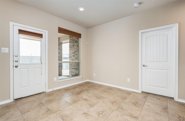 empty room with baseboards