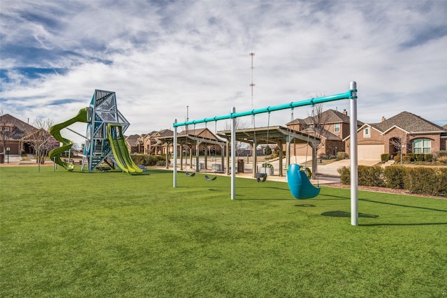 community jungle gym featuring a residential view and a lawn