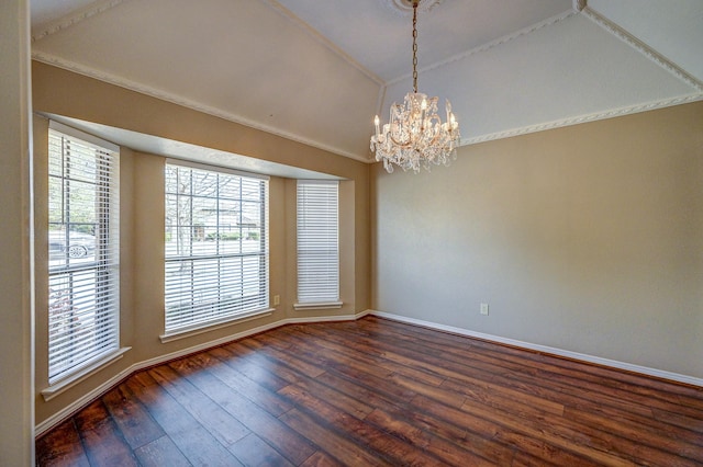 spare room with dark wood-type flooring, a notable chandelier, baseboards, and lofted ceiling