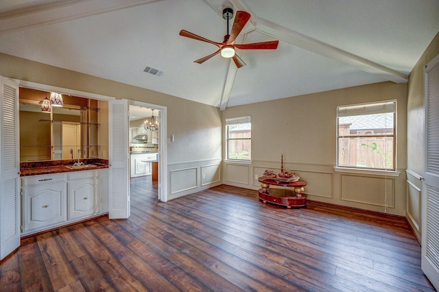 playroom featuring visible vents, vaulted ceiling with beams, dark wood finished floors, ceiling fan with notable chandelier, and a sink