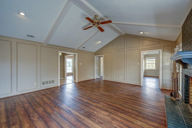 unfurnished living room with visible vents, a fireplace, and a decorative wall