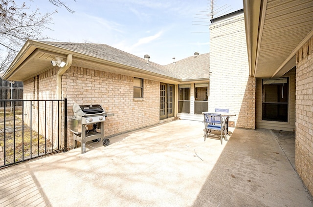 view of patio with grilling area and fence