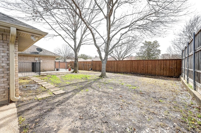 view of yard with a fenced backyard and a patio area