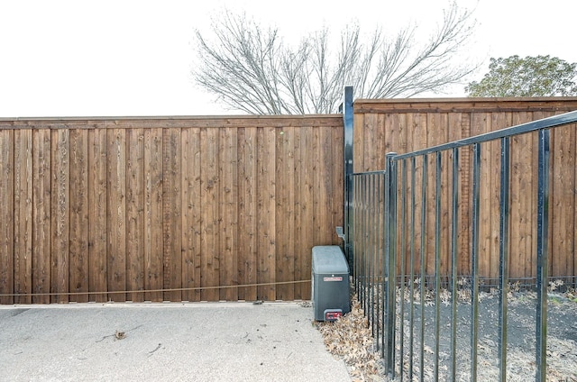 view of gate featuring fence