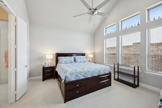 bedroom with high vaulted ceiling, baseboards, a ceiling fan, and light colored carpet