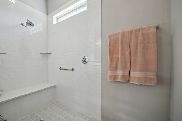 full bath with a tile shower