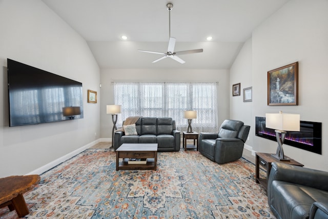 living area with lofted ceiling, ceiling fan, baseboards, and recessed lighting