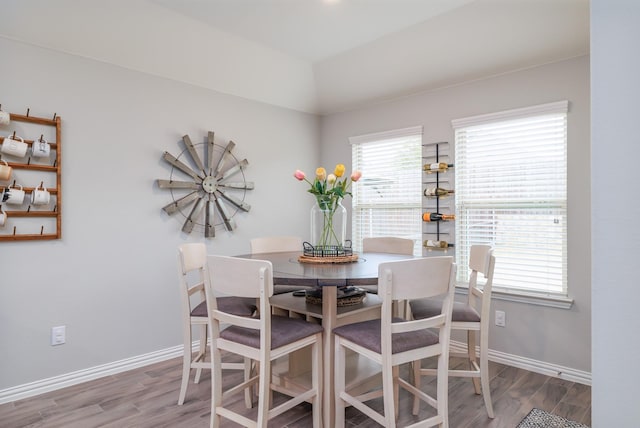 dining room featuring wood finished floors and baseboards