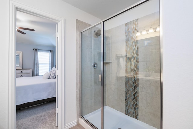 full bathroom featuring a ceiling fan, a shower stall, and ensuite bath