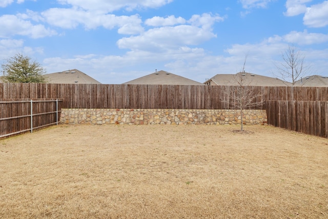 view of yard with a fenced backyard