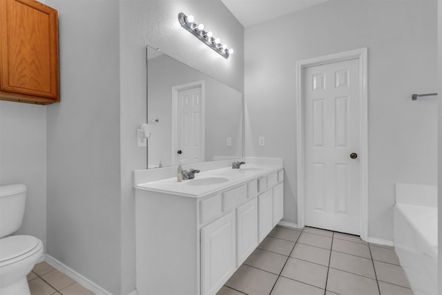 bathroom featuring toilet, a bath, a sink, and tile patterned floors