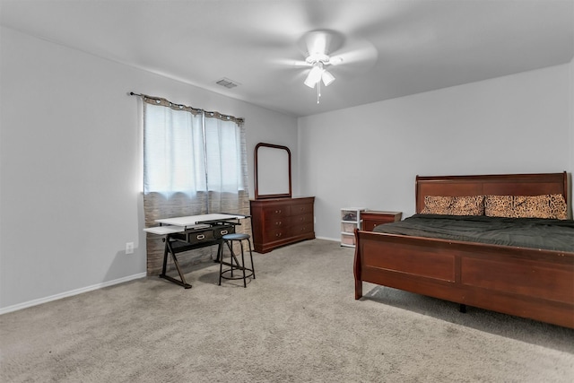 carpeted bedroom featuring baseboards, visible vents, and ceiling fan