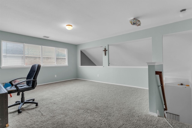 home office with carpet floors, visible vents, and baseboards