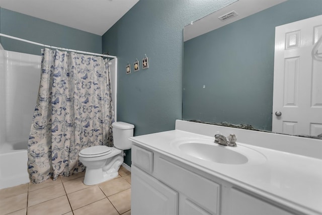 bathroom with visible vents, toilet, shower / tub combo, vanity, and tile patterned flooring