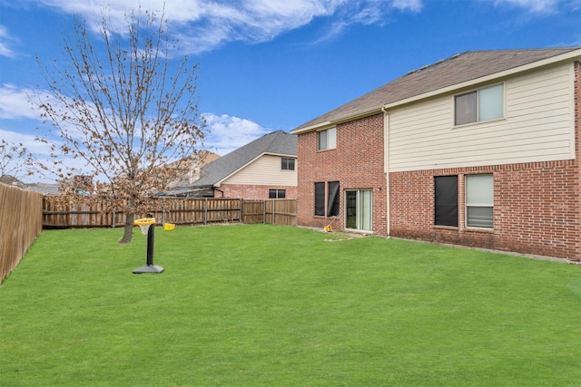 view of yard with a fenced backyard