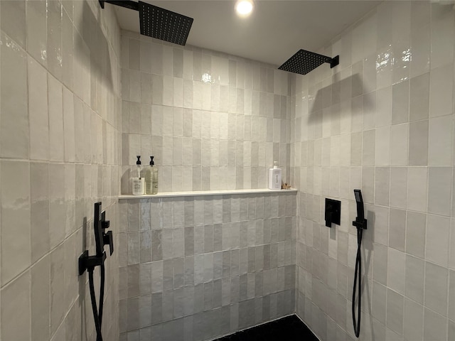 full bath featuring tiled shower