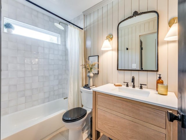 bathroom with vanity, toilet, and shower / tub combo with curtain