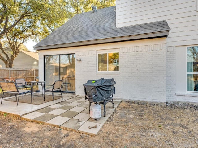 view of patio / terrace featuring fence