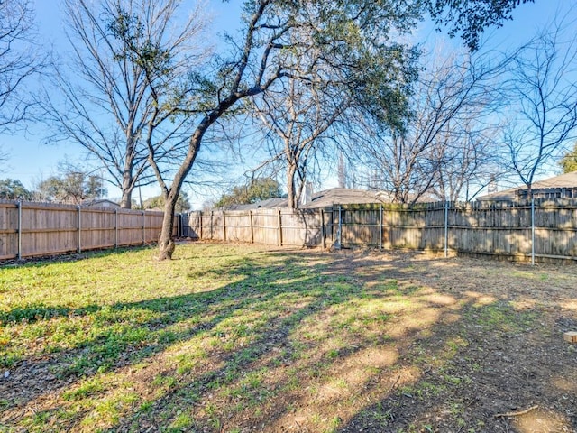 view of yard featuring a fenced backyard