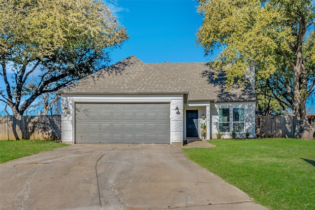 view of front of house with driveway, roof with shingles, an attached garage, fence, and a front lawn