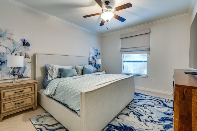 bedroom with a ceiling fan, baseboards, light colored carpet, and crown molding