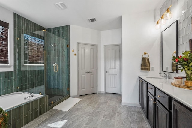 full bath with a shower stall, visible vents, a bath, and vanity