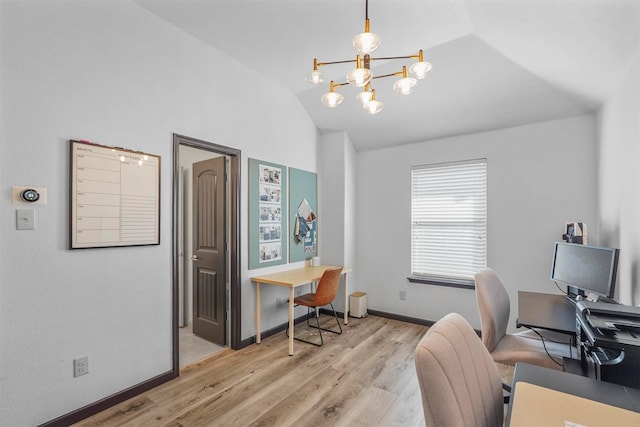 office area featuring vaulted ceiling, a notable chandelier, wood finished floors, and baseboards