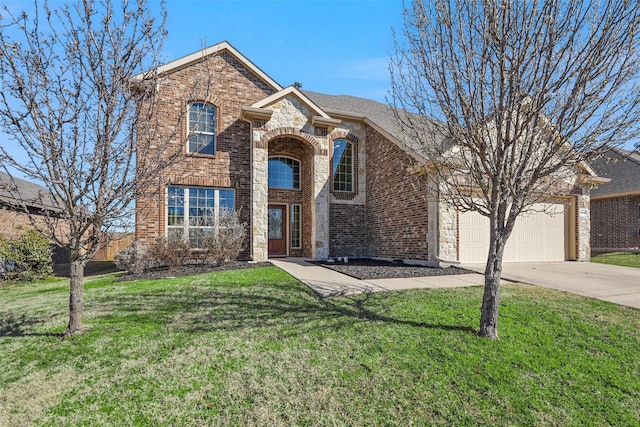 traditional-style home featuring a garage, concrete driveway, stone siding, a front lawn, and brick siding