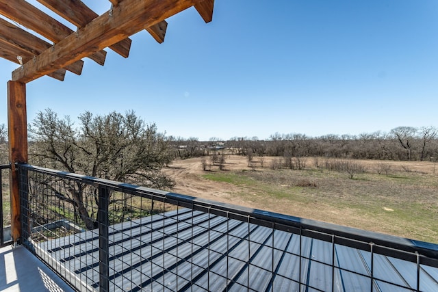 balcony featuring a rural view