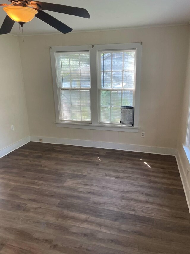 209 S Roosevelt St, Minden, LA 71075 - empty room featuring a ceiling fan, crown molding, dark wood finished floors, baseboards, and cooling unit