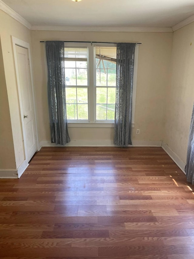 209 S Roosevelt St, Minden, LA 71075 - unfurnished room featuring wood finished floors, crown molding, and baseboards