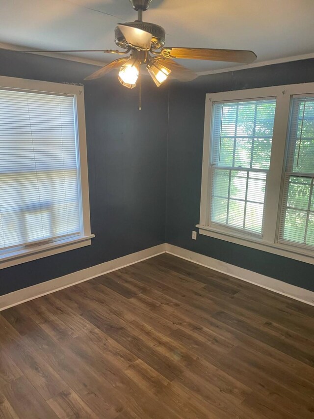 209 S Roosevelt St, Minden, LA 71075 - empty room with a ceiling fan, dark wood-type flooring, and baseboards