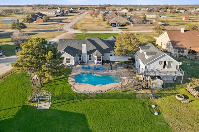 view of swimming pool with a fenced in pool, fence private yard, and a patio area