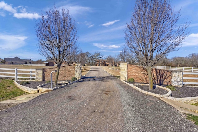 view of street featuring a gate