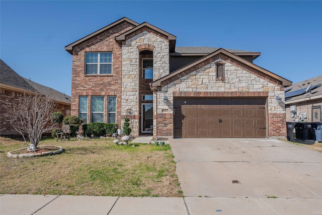 view of front of house with a garage, driveway, a front yard, and brick siding