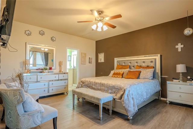 bedroom with ceiling fan and wood finished floors