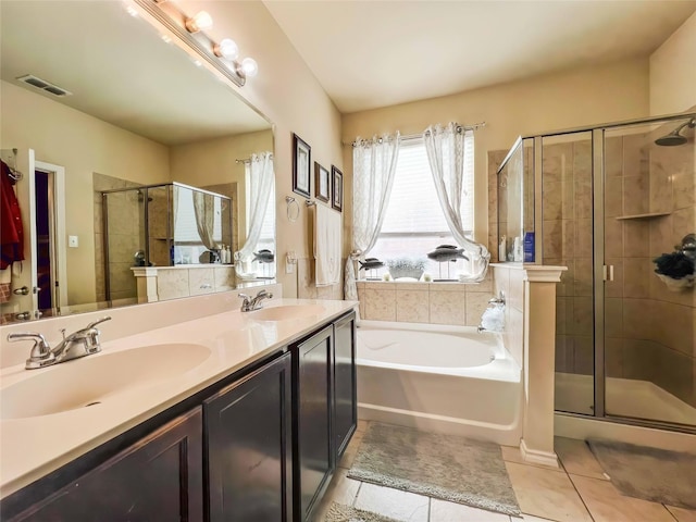 full bath with a stall shower, visible vents, a sink, and tile patterned floors