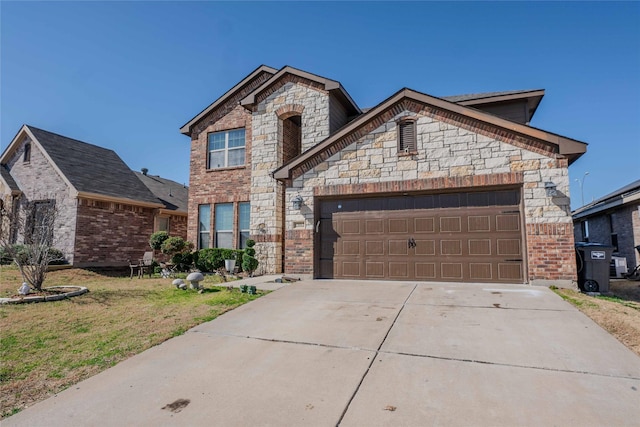 french country style house featuring a front yard, concrete driveway, brick siding, and an attached garage