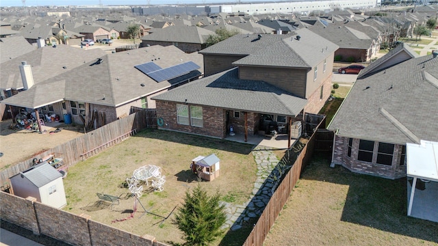 birds eye view of property with a residential view