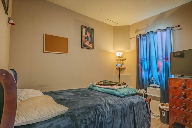 bedroom featuring wood finished floors