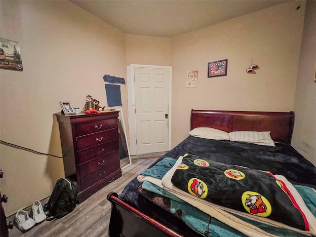 bedroom featuring wood finished floors